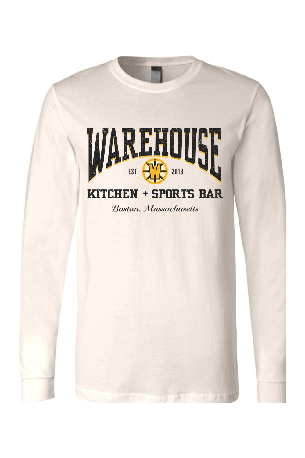 Off-white long sleeve cotton t-shirt featuring a black and gold Warehouse Kitchen + Sports Bar Boston logo.