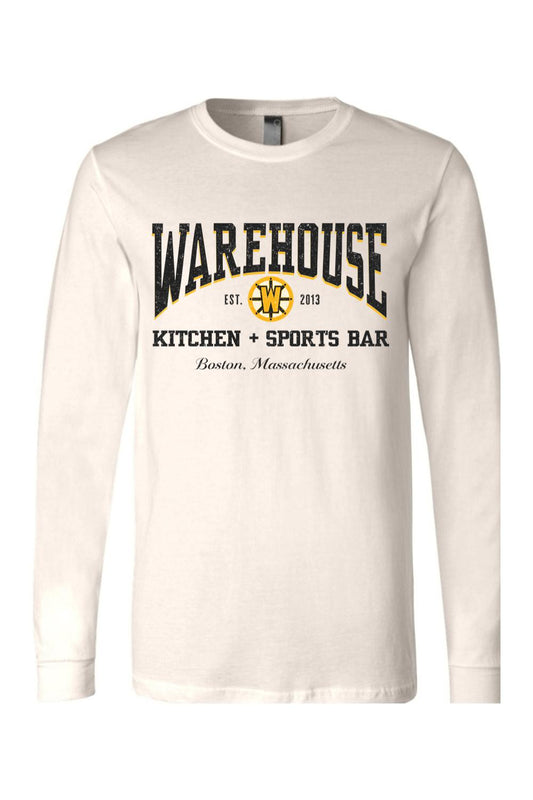 Off-white long sleeve cotton t-shirt featuring a black and gold Warehouse Kitchen + Sports Bar Boston logo.