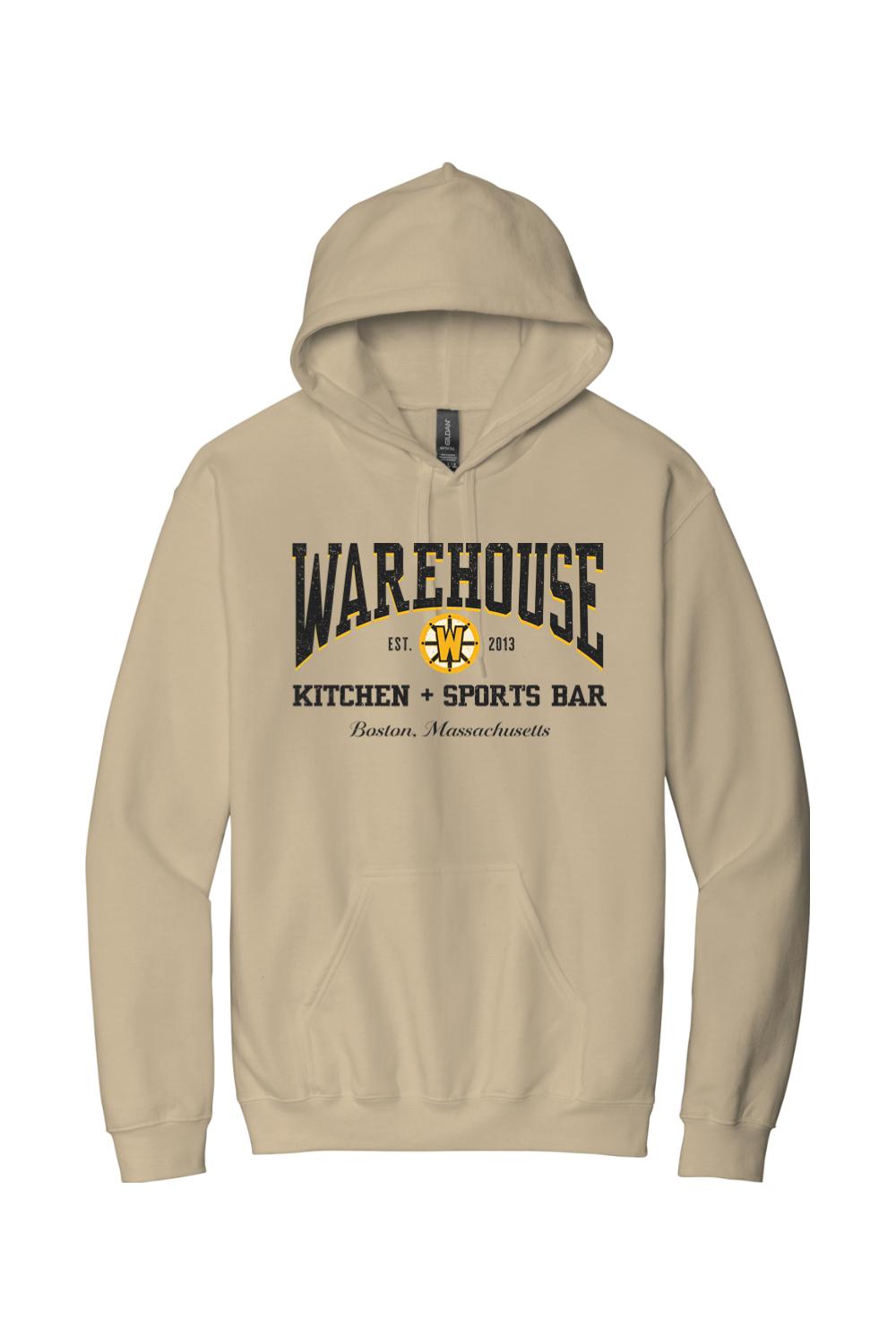 Tan unisex hoodie featuring a black and gold Warehouse Kitchen + Sports Bar Boston logo on the chest.