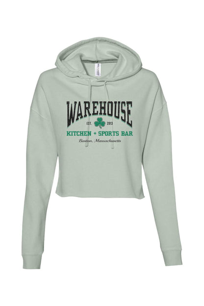 Sage green cropped hoodie with Warehouse Kitchen + Sports Bar Boston logo and clover graphic on the front.