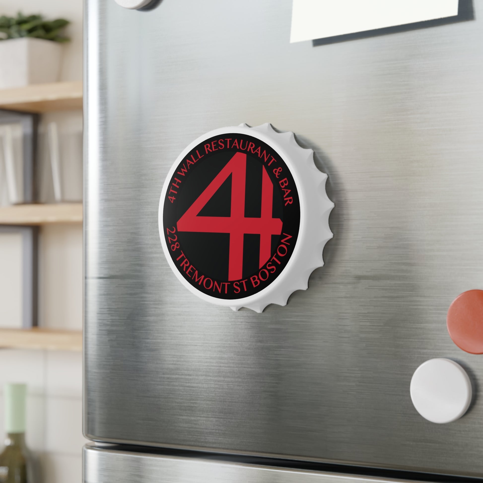 Magnetic bottle cap opener with a matte black and red 4th Wall logo, attached to a stainless steel refrigerator.