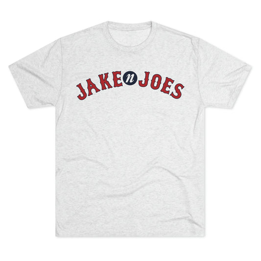 Light gray heathered tri-blend t-shirt featuring a red and blue Jake n JOES Boston baseball-style logo on the chest.