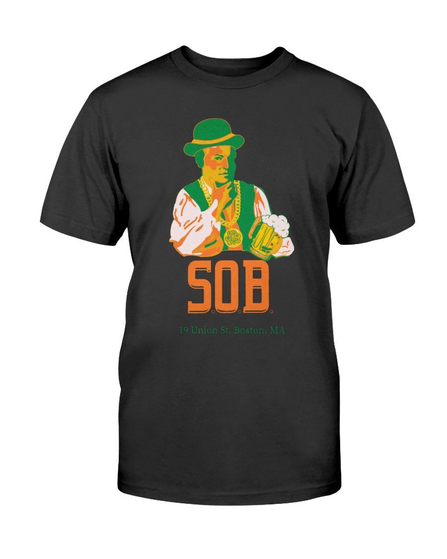 Black crew neck t-shirt featuring a Paul Revere graphic holding a beer with Kiss Me I'm Irish text in green and orange.