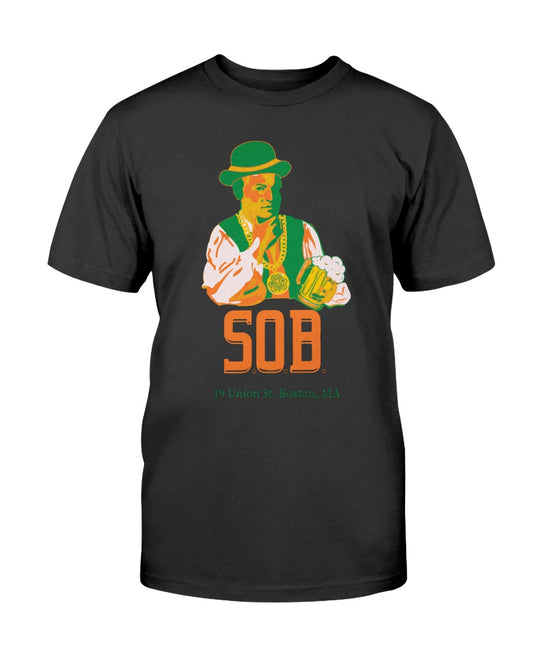 Black crew neck t-shirt featuring a Paul Revere graphic holding a beer with Kiss Me I'm Irish text in green and orange.