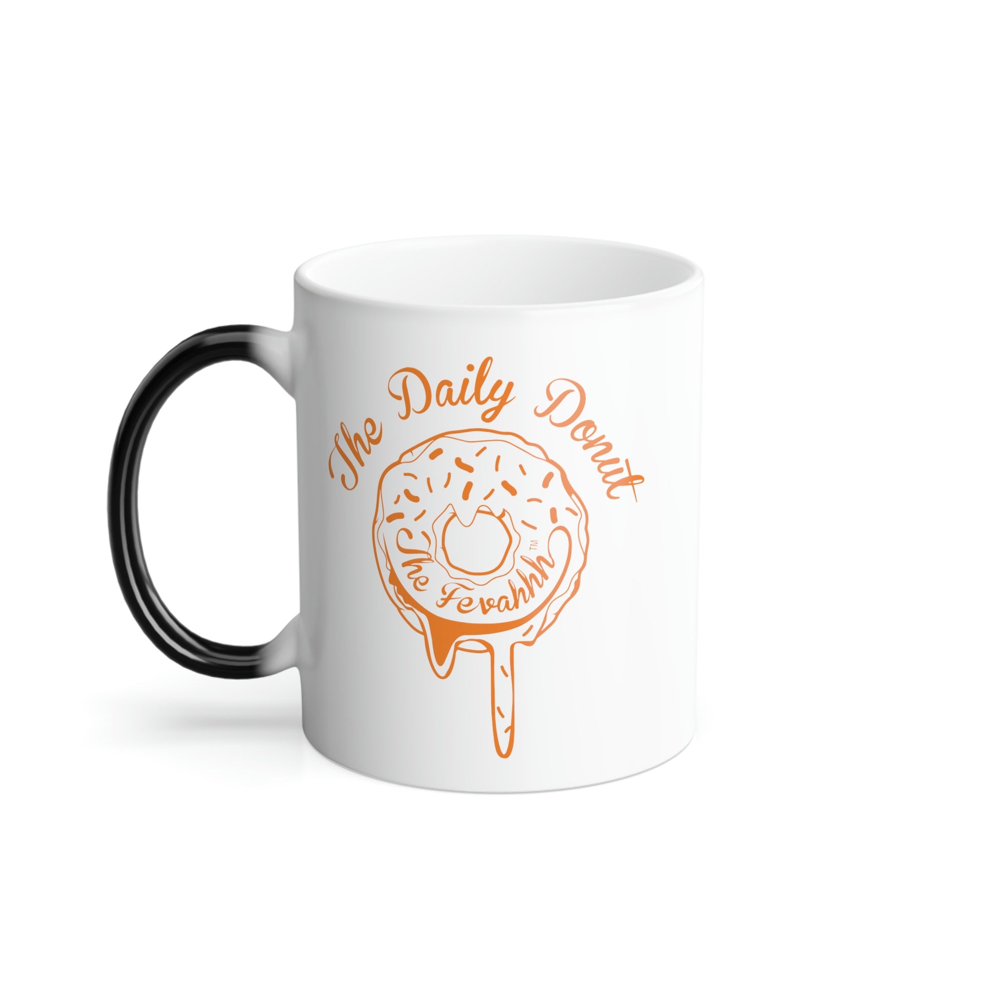 11oz white ceramic mug with a black C-shaped handle and an orange The Daily Donut graphic design.