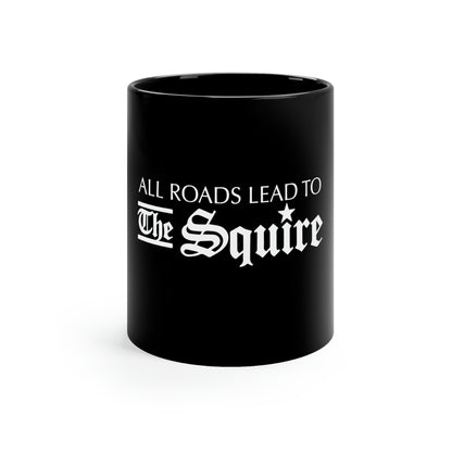 11 oz black ceramic mug featuring the white text All Roads Lead to The Squire with a C-handle design.