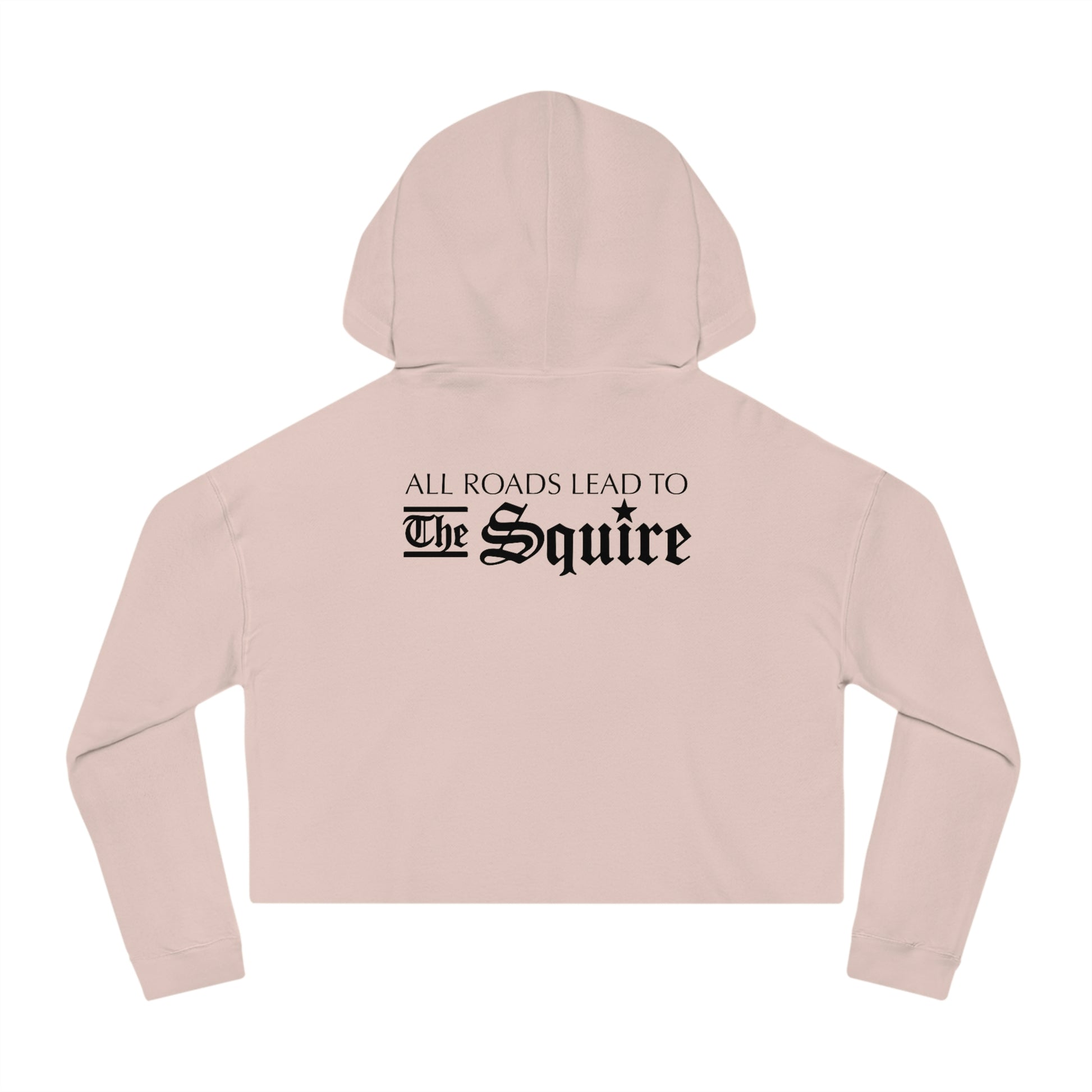 Light pink women's cropped hooded sweatshirt featuring black text on the back that reads All Roads Lead to The Squire.