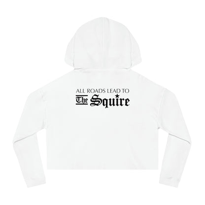 White cropped hooded sweatshirt with black gothic text on the back reading All Roads Lead to The Squire.
