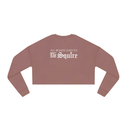 Dusty rose women's relaxed-fit cropped sweatshirt with white text reading All Roads Lead to The Squire on the back.