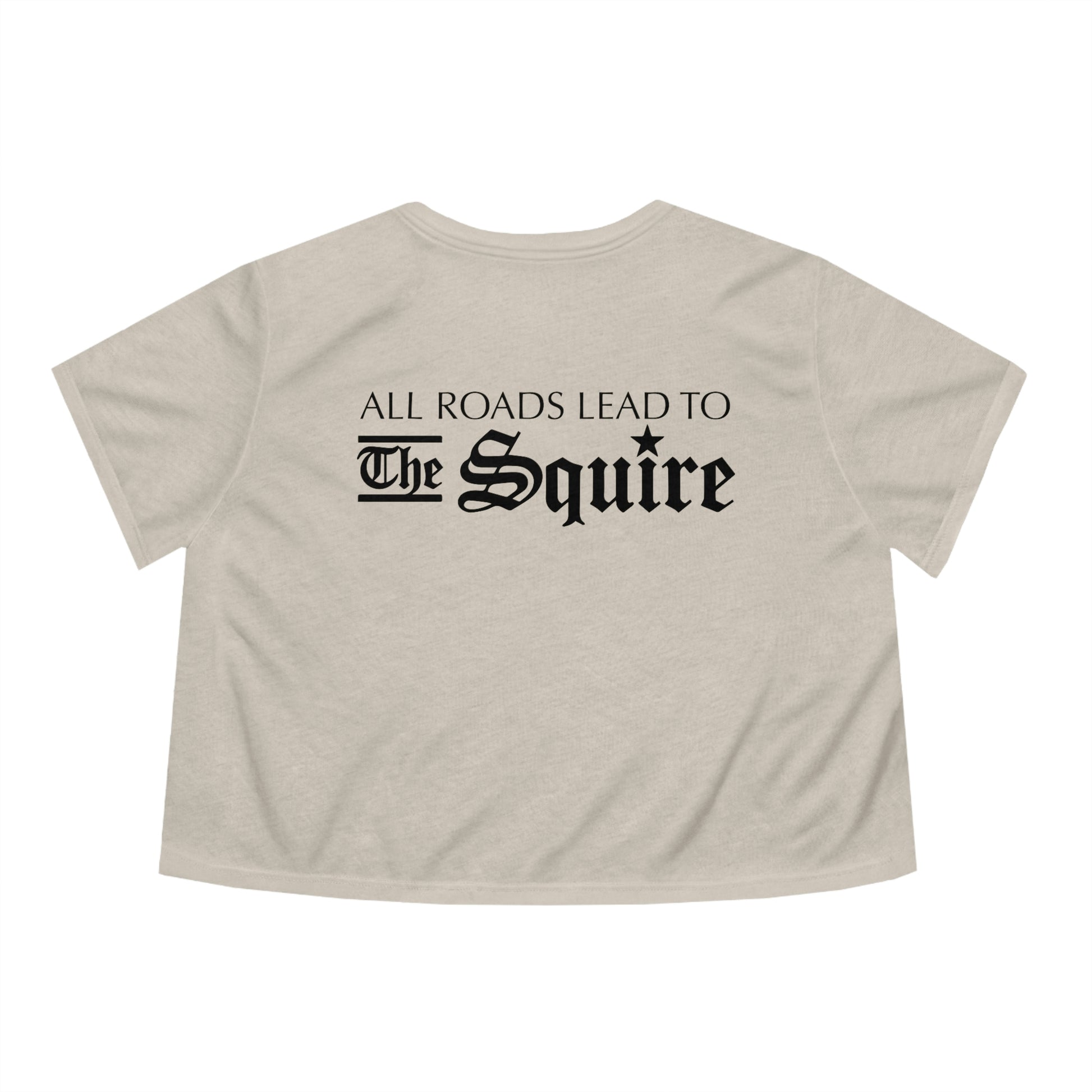 Beige flowy women's cropped tee featuring black text reading All Roads Lead to The Squire in a gothic font.