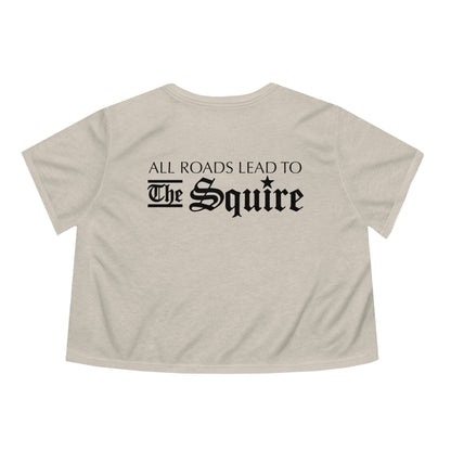 Beige flowy women's cropped tee featuring black text reading All Roads Lead to The Squire in a gothic font.