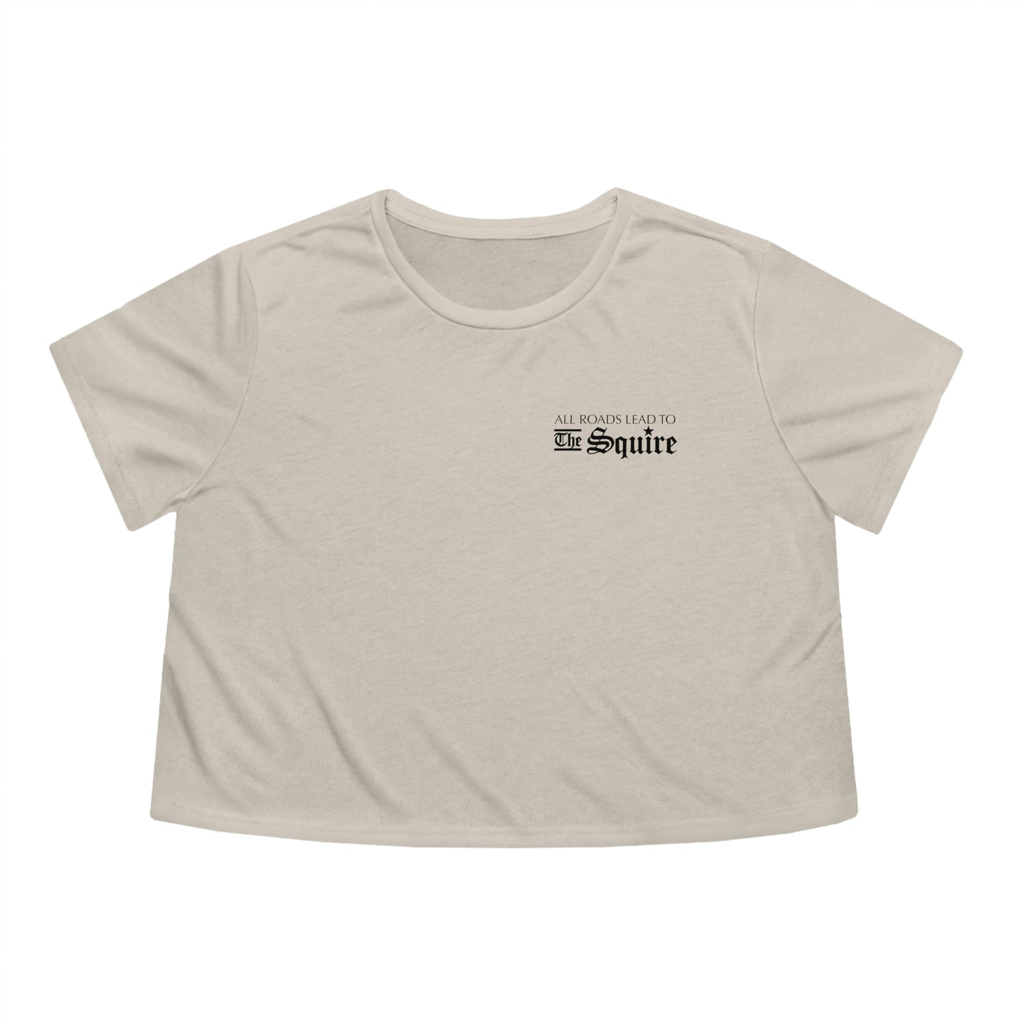 Beige flowy women's cropped tee featuring a small black All Roads Lead to The Squire graphic on the chest.