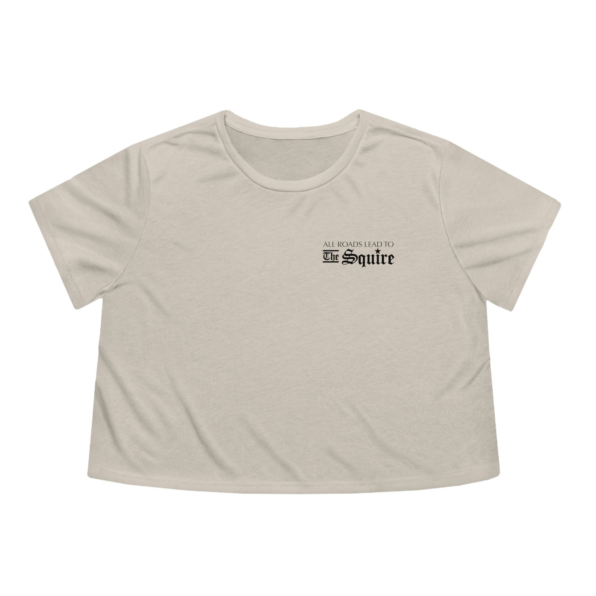 Beige flowy women's cropped tee featuring a small black All Roads Lead to The Squire graphic on the chest.